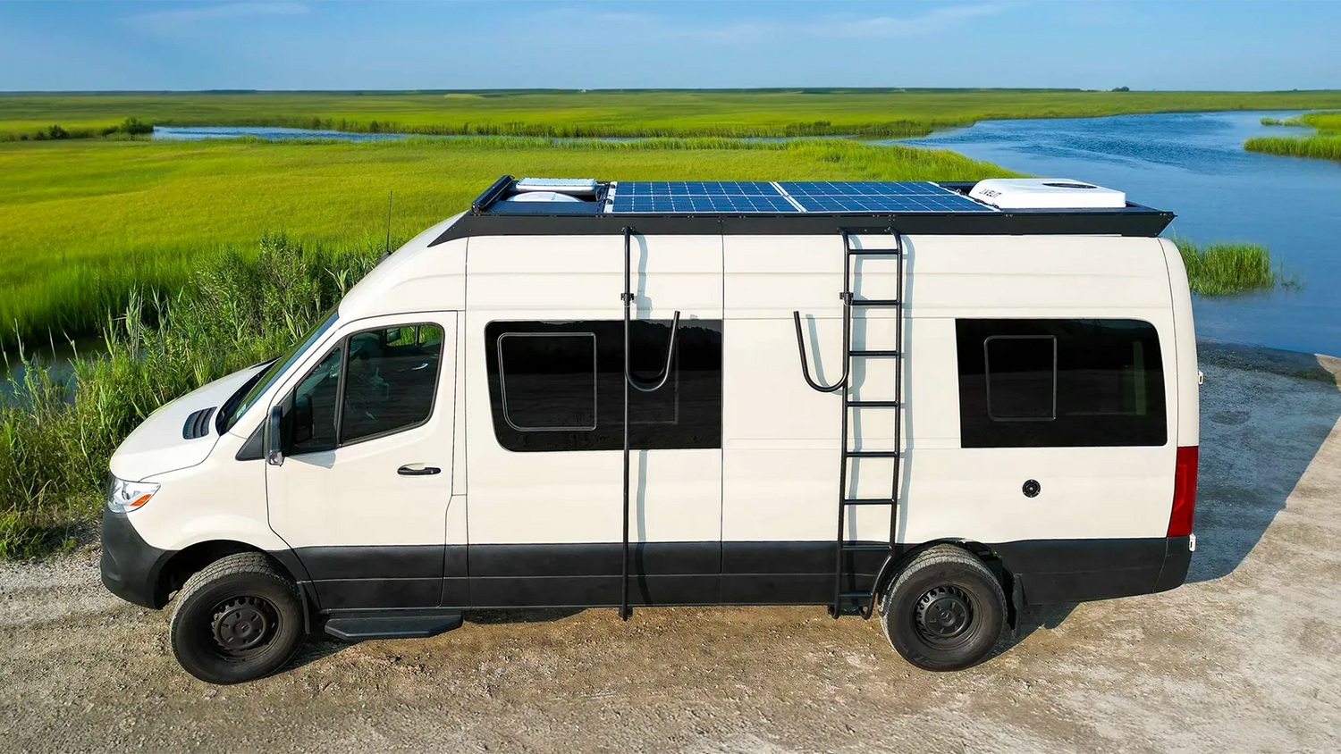 Sprinter van with Orion roof rack, solar panels, and ladder installed