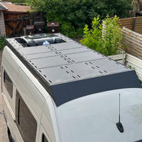 144 orion roof rack with deck panels configured around a rear nomadic x3 helix