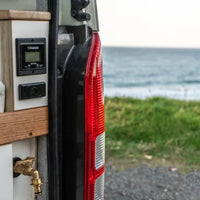 Recessed water tank gauge installed in a camper van interior