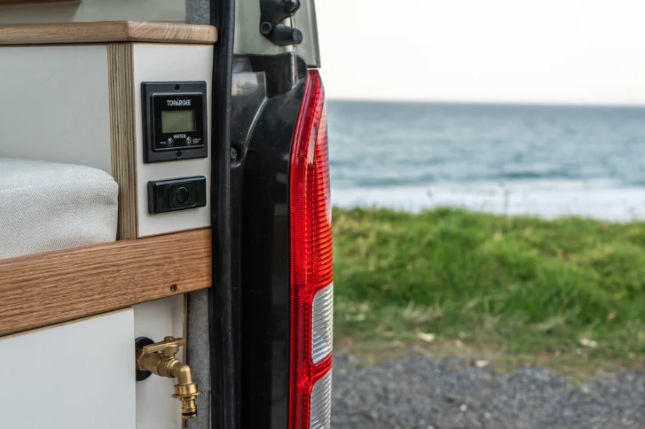 Recessed water tank gauge installed in a camper van interior