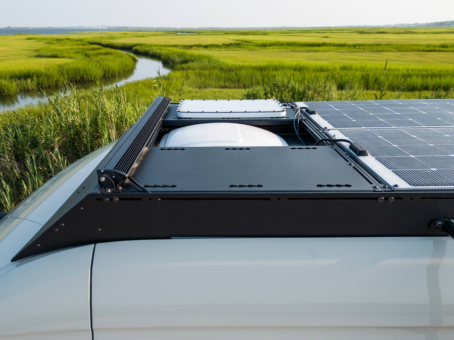 Sprinter Roof Deck Panels on an orion van gear roof rack with maxxair fan