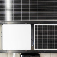 Top down view of Orion flat high performance starlink dish mounted to roof rack with rigid solar and orions flush mounted solar brackets next to 50 watt renogy solar panel