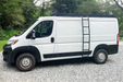 136 low roof ram promaster with orion van gear roof rack and side ladder on gravel