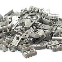 A pile of Roll-In T-Nuts w/ Ball Spring - Stainless Steel