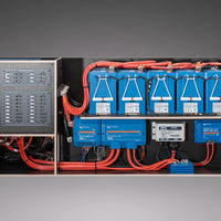 Electrical panel with blue batteries and red wiring on a gray background