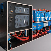 Electrical panel with blue batteries and wiring on a gray background