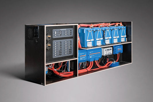 Electrical panel with blue batteries and wiring on a gray background