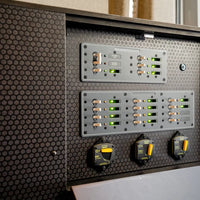 Close-up of breaker panels and switches on the pre-wired Victron Sprinter power box