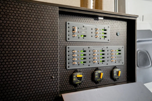 Close-up of breaker panels and switches on the pre-wired Victron Sprinter power box