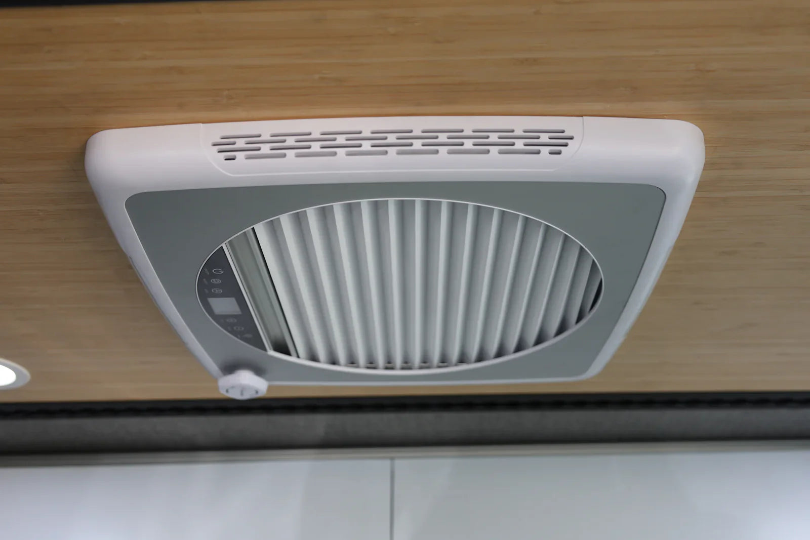 Close-up of pleated blackout blind and removable insect screen included with ProBreeze vent