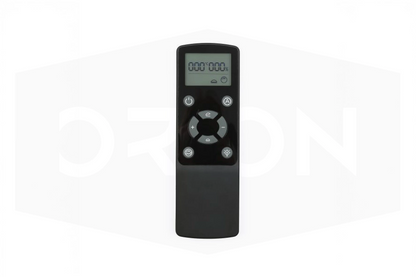 Black remote control with digital display on a white background