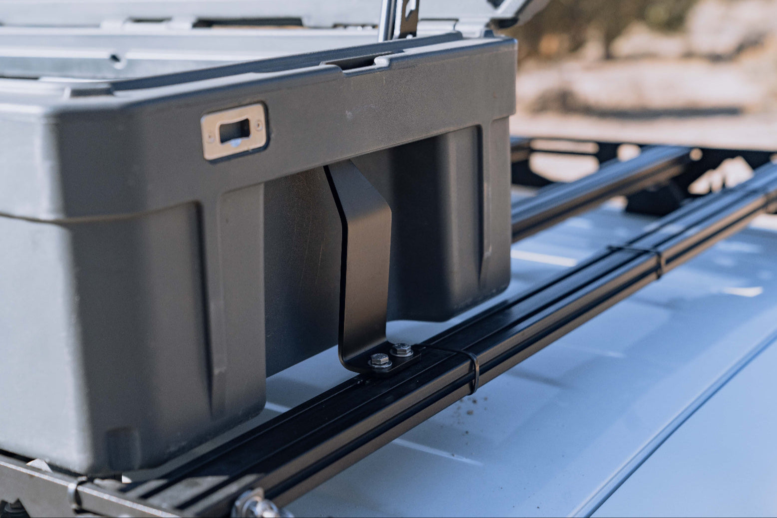 Close up of roam rigid mount and case on roof rack with 8020 crossbars