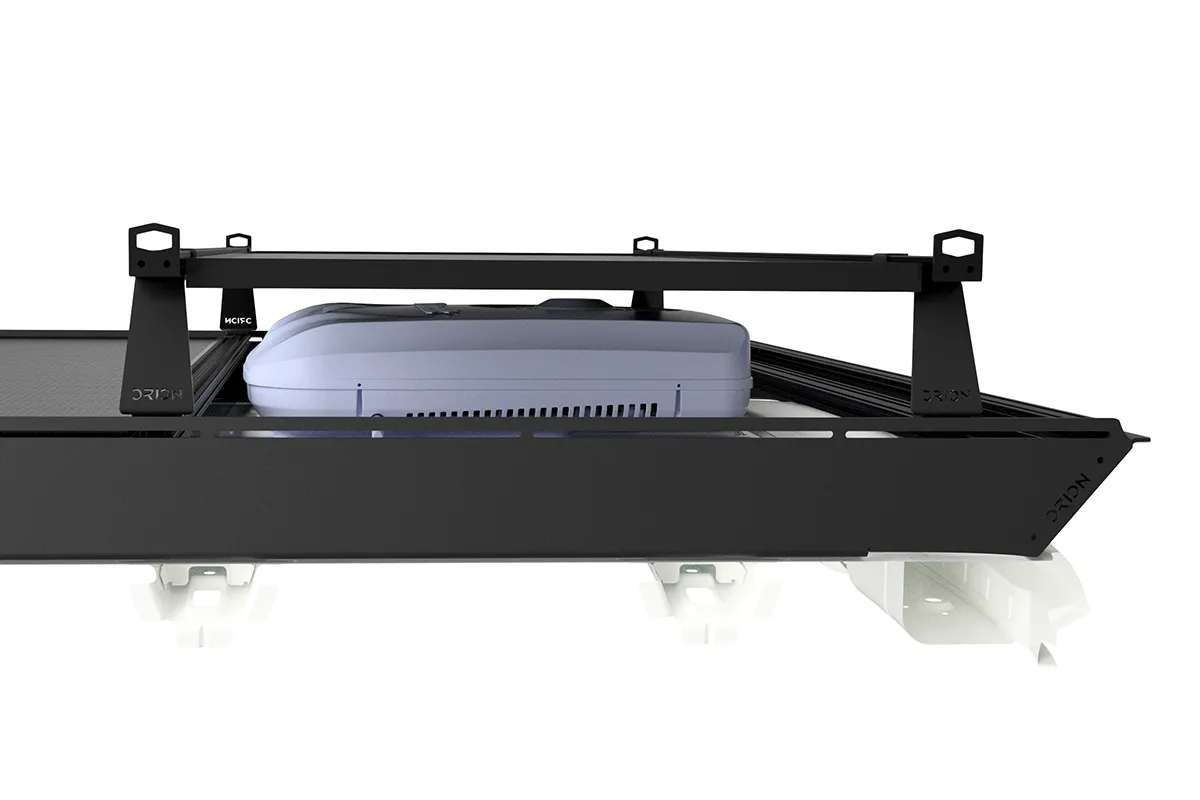Roof rack with riser bar crossbars with solar panel over air conditioner on a van