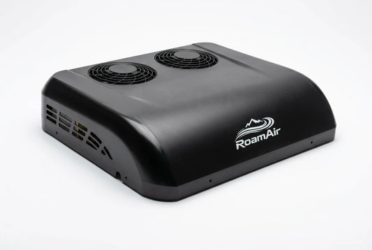 Black RoamAir R2 12V and 48V rooftop air conditioner and heat pump, front three-quarter view