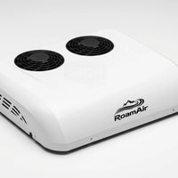 White RoamAir R2 12V and 48V rooftop air conditioner and heat pump, front three-quarter view