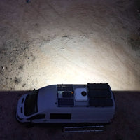 Senna 45 LED Scene Light mounted on a van roof rack at night