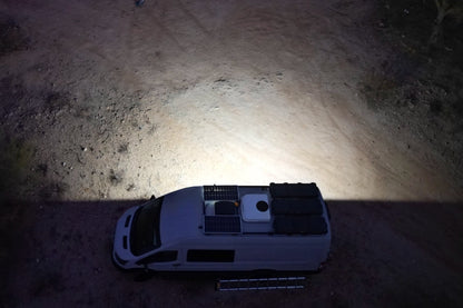 Senna 45 LED Scene Light mounted on a van roof rack at night