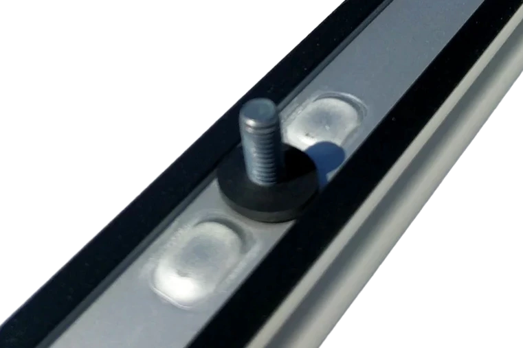 Underside view of OEM Sprinter roof rail showing stud, rubber washer, and factory sealing for watertight installation