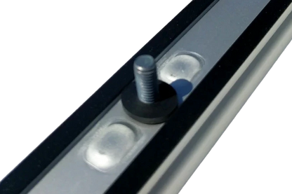 Underside view of OEM Sprinter roof rail showing stud, rubber washer, and factory sealing for watertight installation