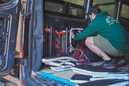 Person installing thinsulate on a van