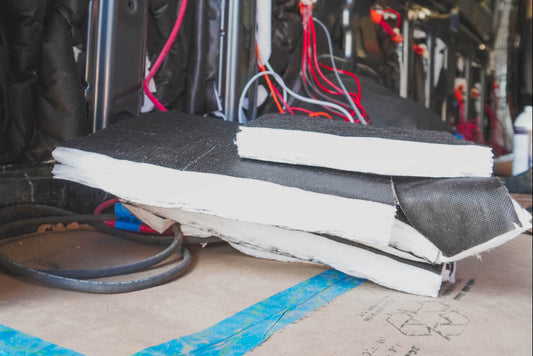 Stack of 3m thinsulate insulation materials with electrical wiring in the background