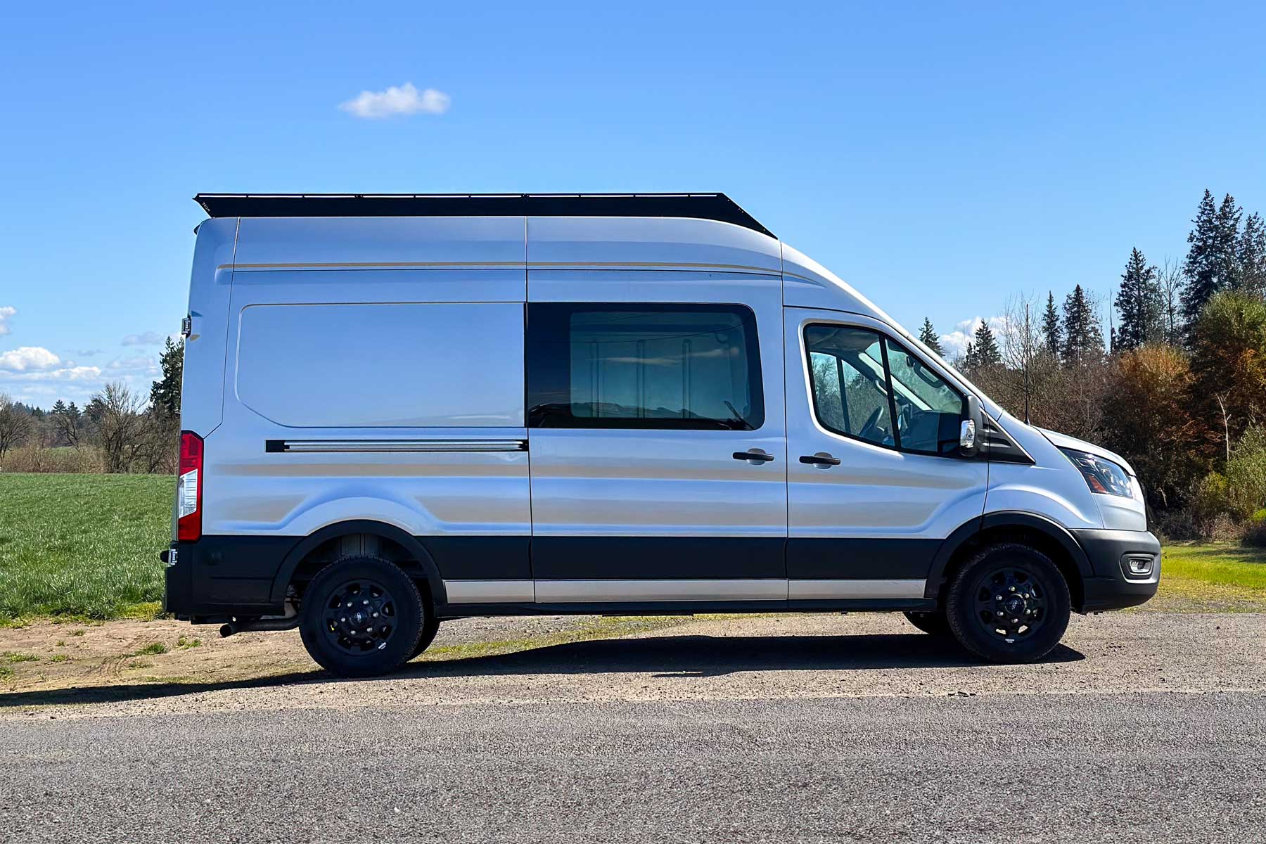 Ford Transit 148 High Roof model equipped with the new Stealth+ Roof Rack, ready for adventure.