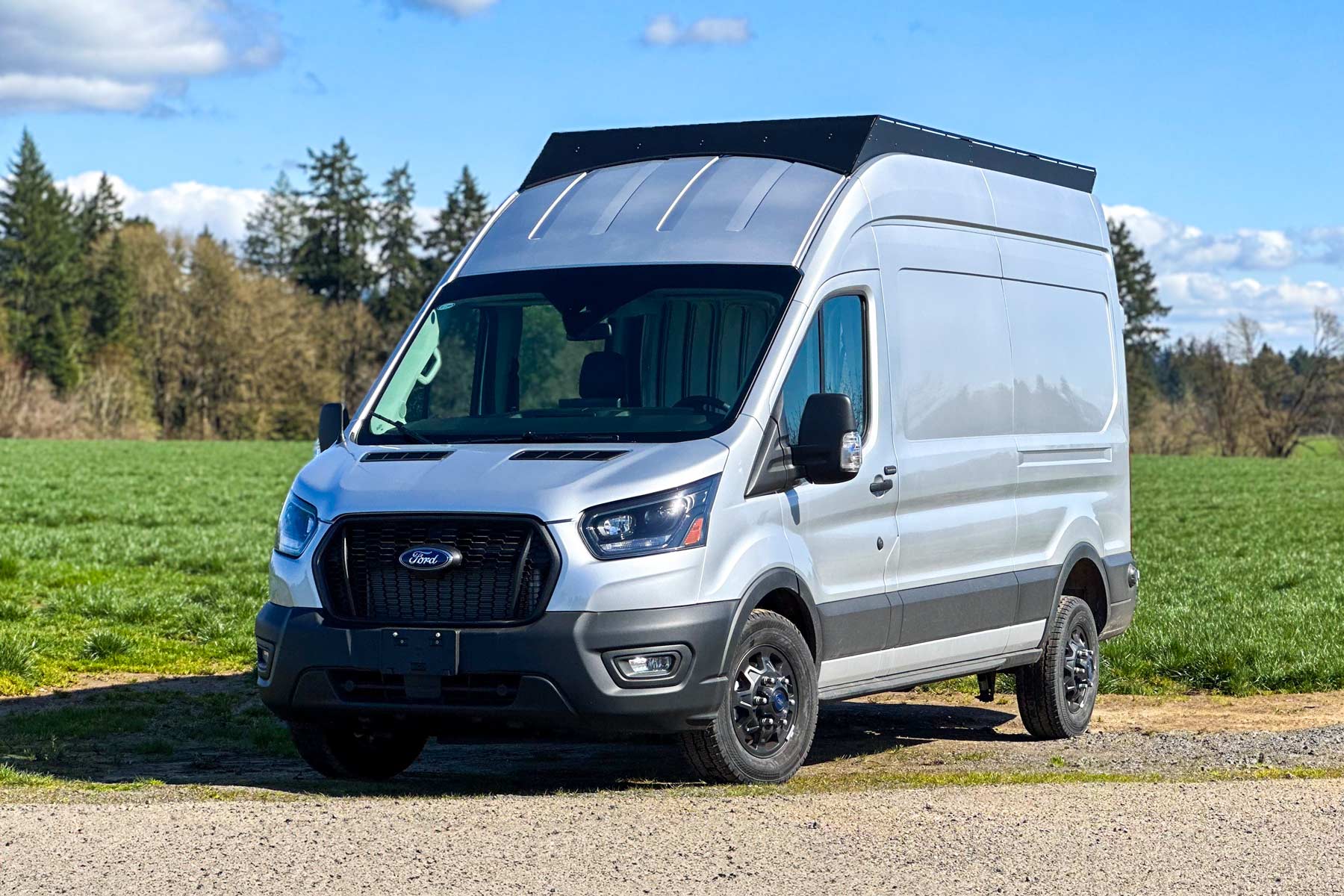 Ford Transit with Stealth+ Roof Rack installed, showcasing sleek design and perfect fit.
