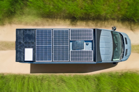Birds eye view of orion van gear transit roof rack with 700 watts of solar panels, rear deck panels, starlink, and maxfan