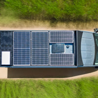 Birds eye view of orion van gear transit roof rack with 700 watts of solar panels, rear deck panels, starlink, and MAXXAIR Maxxfan Fan 00-07500K