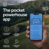 Hand holding a smartphone displaying the VictronConnect app with a scenic background