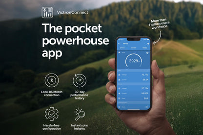 Hand holding a smartphone displaying the VictronConnect app with a scenic background