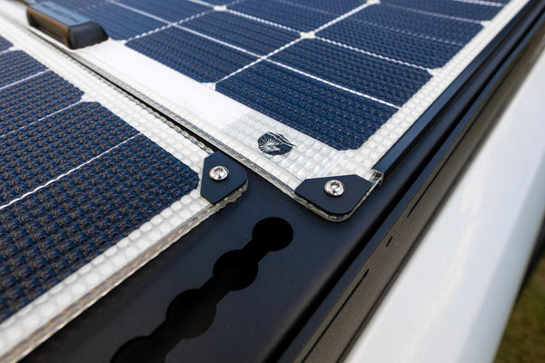 Walkable Solar Panels mounted to an Orion Van Gear roof rack using Orion corner washers