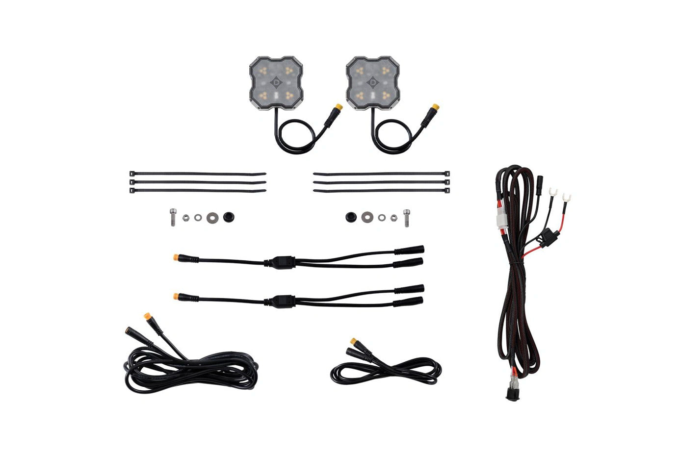 A kit of two square LED light modules with wiring, several black zip ties, mounting hardware, and connector cables, arranged neatly on a solid white background.