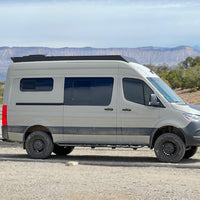 144 sprinter van with orion roof rack that has been off roading in the desert