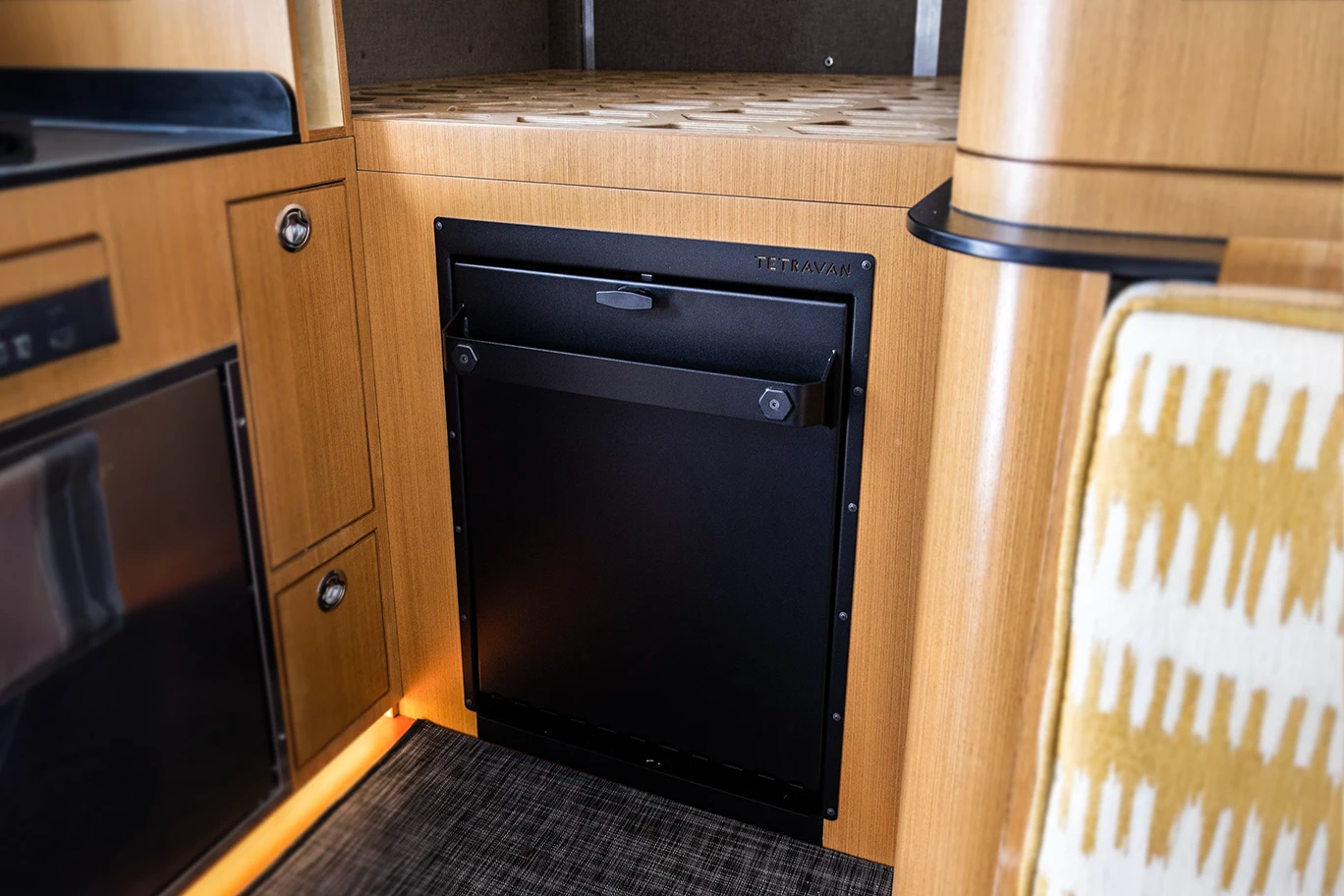 Bulkhead mount layout for Tetravan Folding Shower in an under-bed van cabinet