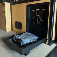 Tetravan folding shower showing stainless fixtures, drain, latch, and black finish