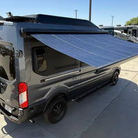 Girard GG750 Solar Awning showing shade coverage and solar output surface on ford transit van