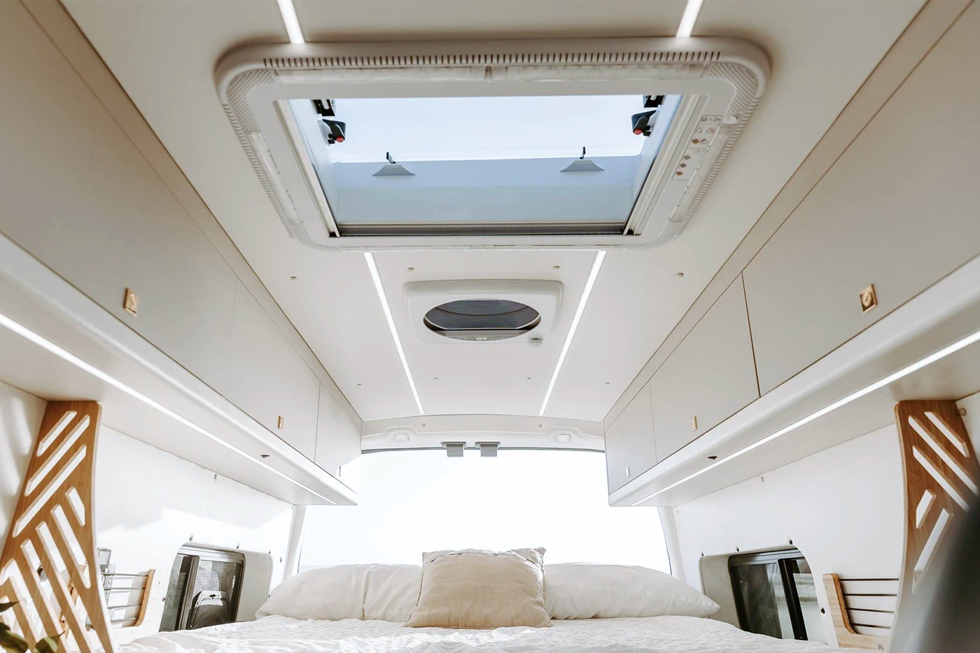 NomadicArk 700 x 500mm skylight installed in the roof of van above bed