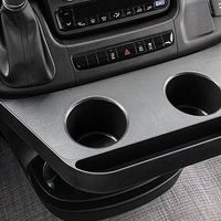 Ram Promaster dashboard with a console, cup holders, and a touchscreen display.