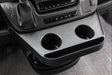 Ram Promaster dashboard with a console, cup holders, and a touchscreen display.