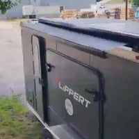 Video of Girard GG750 Solar Awning installed on trailer going in and out