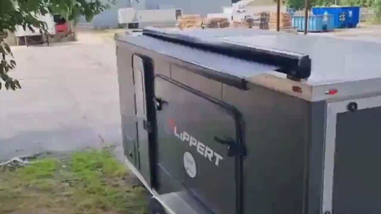 Video of Girard GG750 Solar Awning installed on trailer going in and out