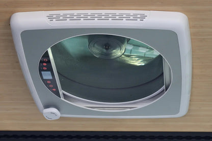 Interior view of ProBreeze roof fan open, grey garnish with white trim, reversible blades visible