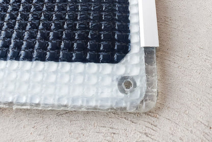 Close up of mounting corners and ETFE laminate non-skid surface (panel has white backing)