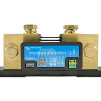 Electrical measurement device with digital display and brass connectors on a white background
