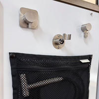 Tetravan shower port system with storage pouch and plumbing hoses