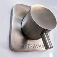 Metallic shower handle with 'Tetravan' branding on a white background