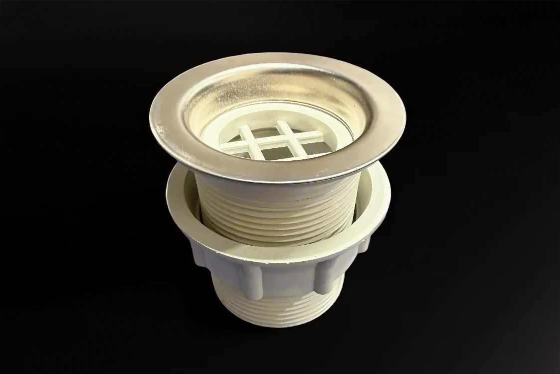 Close-up of stainless steel van shower pan drain