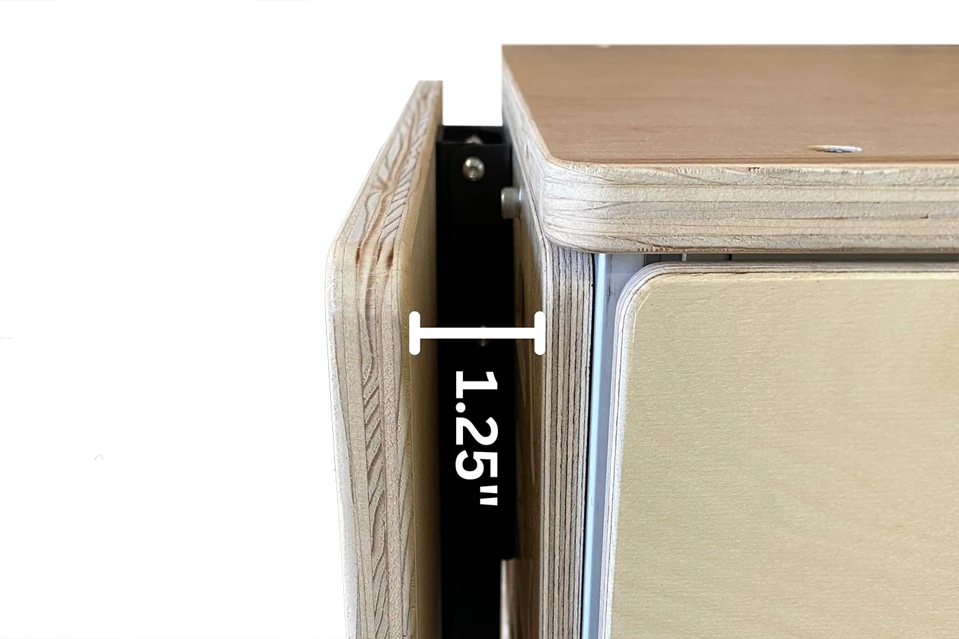 Wooden drawer with a measurement label indicating 1.25 inches.