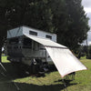 Awning Extension shown on a 4Wheel Camper with an Fiamma F45s 260 awning. Red Trim, black patches, Grey Tarp